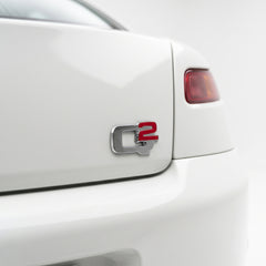 Emblema scris Q2