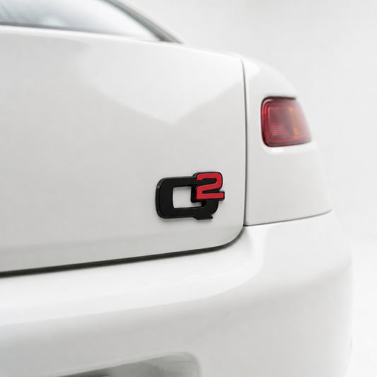 Emblema scris Q2